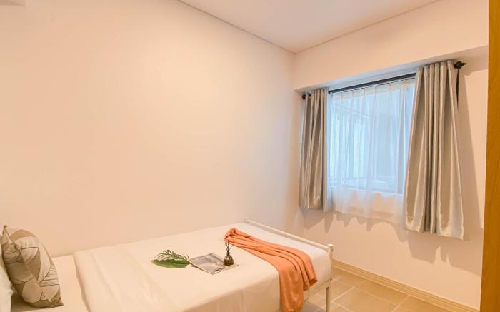 Enjoy Living 2BR at Meikarta Apartment By Travelio