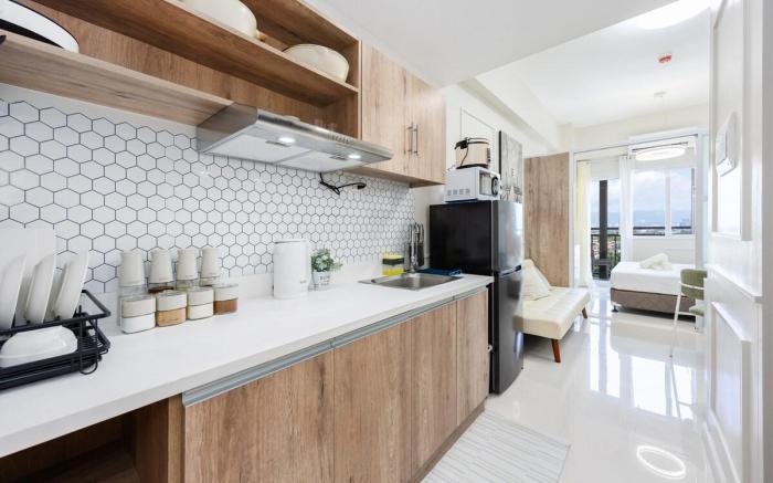 Chic Studio with Balcony & City View Near Airport