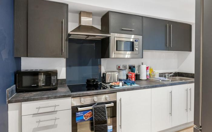 Spacious 4BR Home in Wigan | Garden & Parking