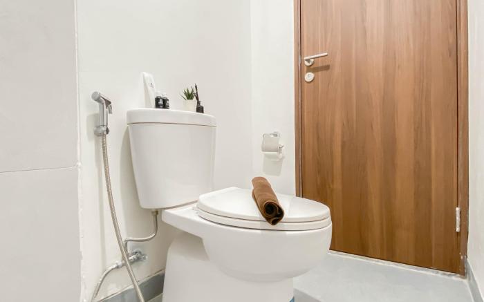 Soft Grey 1BR at Royal Sentul Park By Travelio