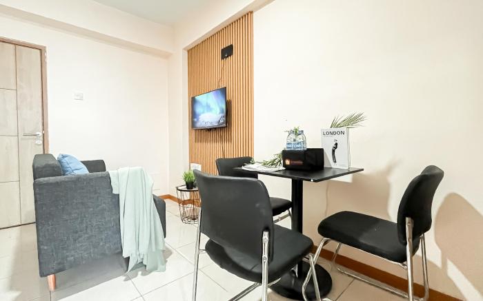 Basic 2BR Apt at Green Palm Residence By Travelio