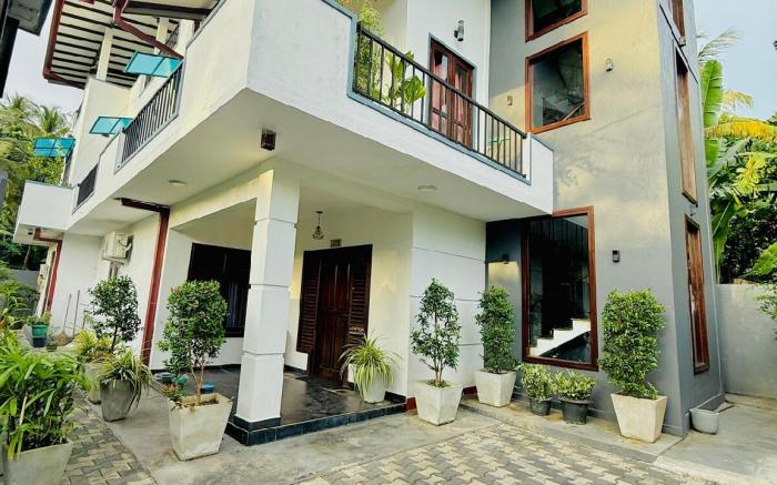 Grey Home Villas by ‘R Dodwell’