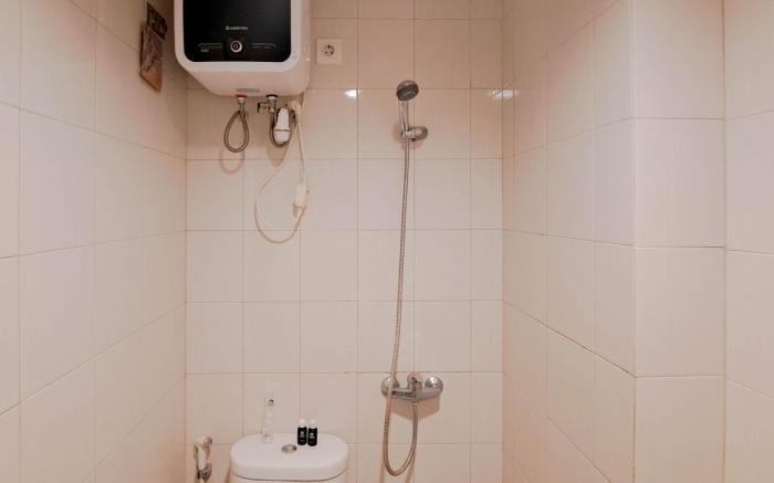 Wooden Accent 2BR at Mekarwangi Square By Travelio