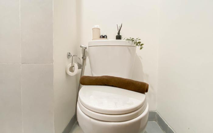 Cream Tone 1BR Royal Sentul Park Apt By Travelio