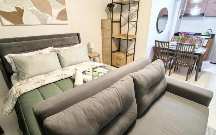 Stylish Condo Stay w/ Pool, Balcony & Near Airport