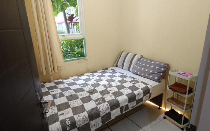 Malioboro City Apartment Family Room by Liliput