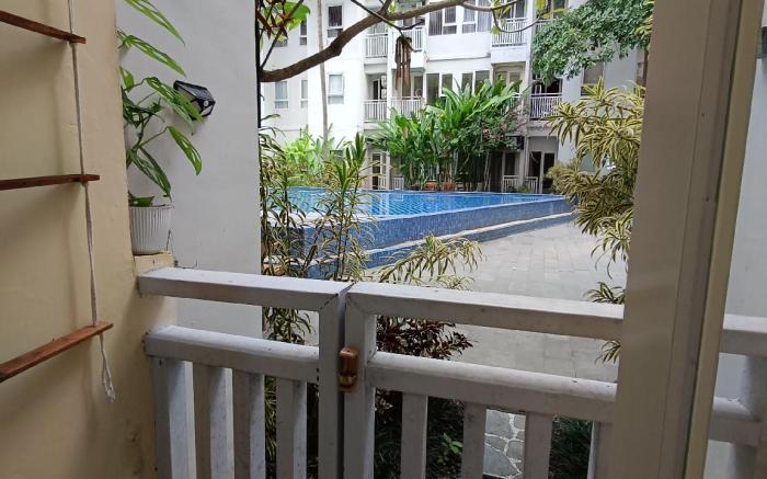 Malioboro City Apartment Family Room by Liliput