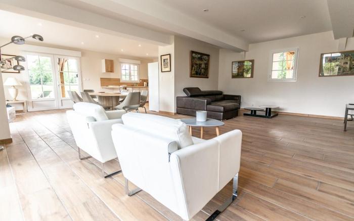 Large house in the forest bordering a lake