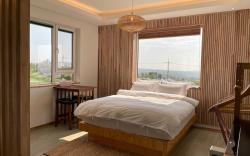 C#1 West Sunset View Full Window Distant Sea View Rattan Wood Room