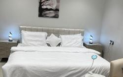 Quiet studio with master bed and side seat