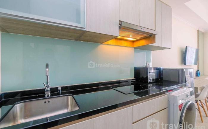 Warm Studio at Menteng Park Apartment By Travelio