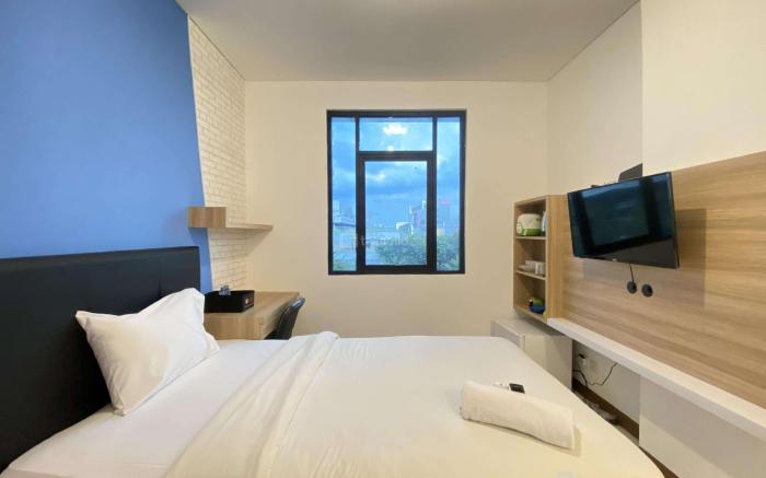 Simply Studio Room Semi Apartment at The Lodge Paskal near BINUS University By Travelio