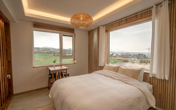 C#1 West Sunset View Full Window Distant Sea View Rattan Wood Room