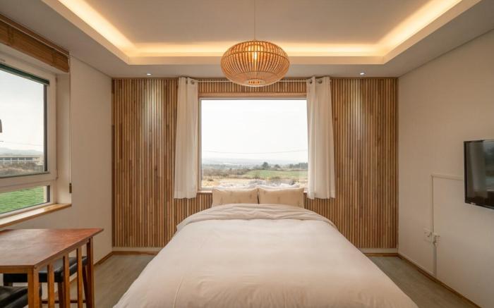 C#1 West Sunset View Full Window Distant Sea View Rattan Wood Room