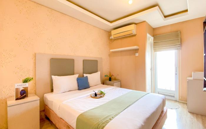 Warm Homey 2BR at Green Bay Pluit Apt By Travelio