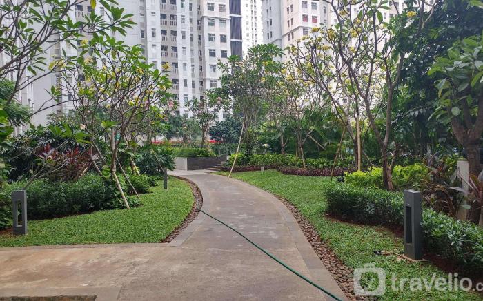 Homey 2BR at Green Bay Pluit Apartment By Travelio